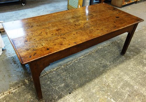 A George III oak farmhouse table, with cleated four plank top over single frieze drawer, on tapering square supports, 85cm wide x 183cm long.