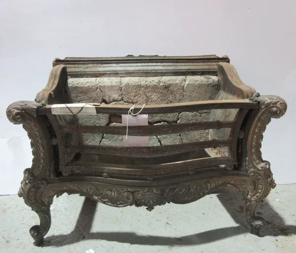 A 19th century cast iron fire place with brass shell decoration.   J4