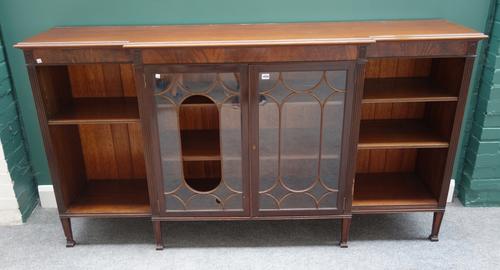 Warings, 118 Deansgate, Manchester; a George III style mahogany breakfront bookcase, the pair of astragal glazed doors flanked by open shelves, on tap