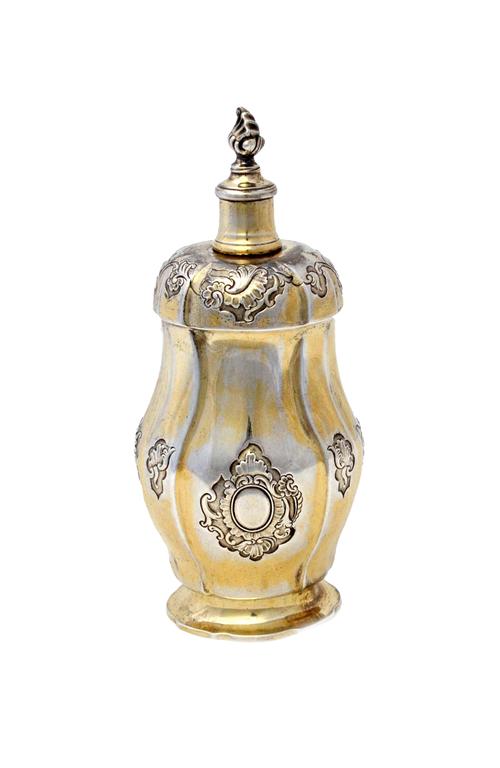 A Danish Sterling silver gilt bottle, having a screw top with a flaming finial, the body decorated with rococo cartouches and on a shaped oval foot, b