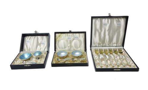 A Danish set of six Sterling silver gilt and white enamelled pastry forks by Egon Laurisden, detailed Denmark Sterling, with a fitted case, a pair of