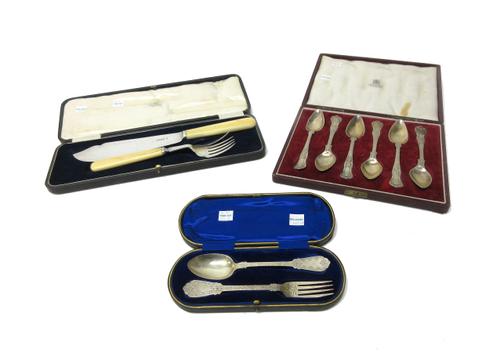 Silver, comprising; a set of six King's pattern grapefruit spoons, Sheffield 1953, cased, a pair of fish servers, Sheffield 1927, cased and a christen