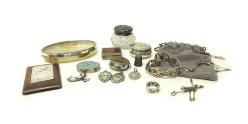 A silver lidded faceted glass toilet jar, Birmingham 1902, a silver rimmed oval onyx trinket dish, a thimble, a decanter label detailed Whisky, three