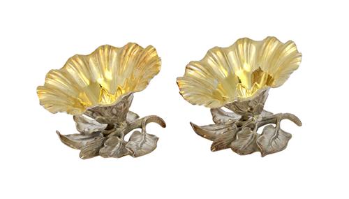 A pair of William IV silver salts, each modelled as a single flowerhead, gilt within and raised on a foliate spray base, London 1832, diameter 9cm, co