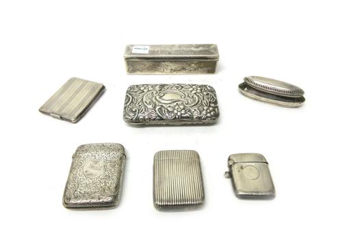 Silver, comprising; a Victorian rectangular vesta case, having banded decoration, Birmingham 1885, two further vesta cases, a rectangular book matches