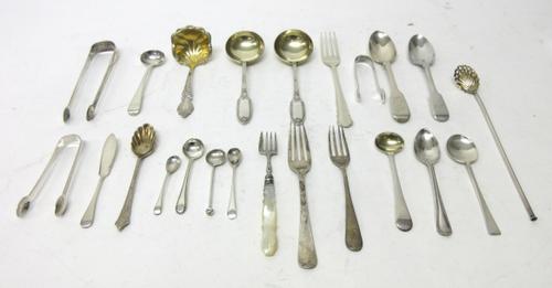 Silver flatware, comprising; three pairs of sugar tongs, a butter knife, six salt and mustard spoons, five further spoons, three various forks and ano