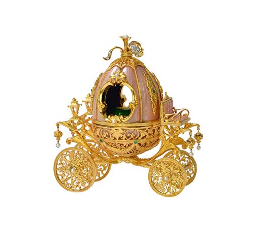 A Franklin Mint for Faberge enamelled, gilt, cultured pearl and gem set Cinderella Coach and Slipper novelty music box, the carriage supporting a cent