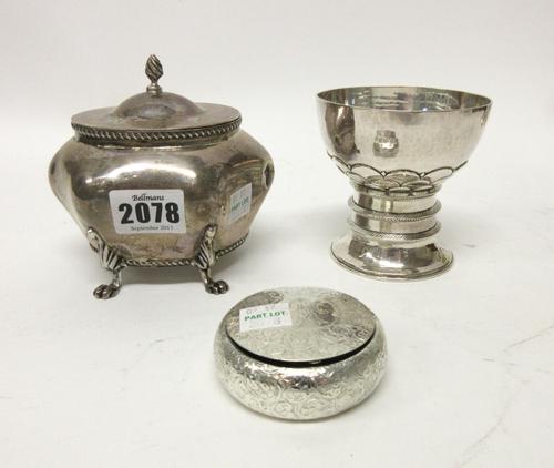A silver tea caddy decorated with gadrooned rims, the hinged lid with wrythen knop finial and raised of four paw feet, Birmingham 1901, a circular hin
