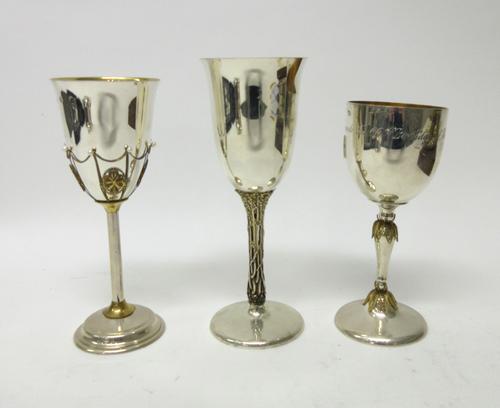 A group of three modern silver and silver gilt limited edition commemorative goblets, including; one detailed To Commemorate The 60th Birthday of Her