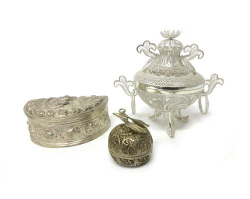 A filigree model of an Oriental twin handled incense vase and cover, fitted with ring handles and raised on three feet, detailed SILVER 925, an Easter