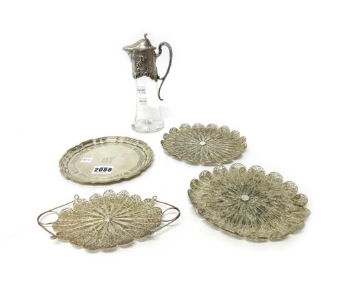 Foreign and plated wares, comprising; a shaped circular dish detailed Sterling, diameter 15.5cm, a small glass liqueur jug the mount decorated in the
