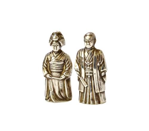 A pair of silver condiments, one designed as the standing figure of a Japanese man and the other designed as the standing figure of a Japanese lady, b
