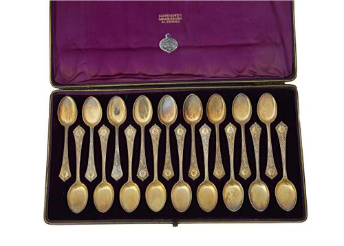 Eighteen Victorian silver gilt ice cream spoons, the handles with engraved decoration,  twelve London 1882 and six London 1886, combined weight 425 gm