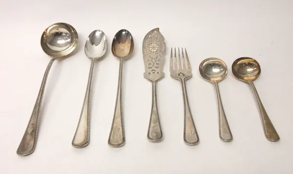 Late Victorian silver decorated edged Old English pattern table flatware, comprising; a soup ladle, Birmingham 1893, a pair of fish servers, a pair of