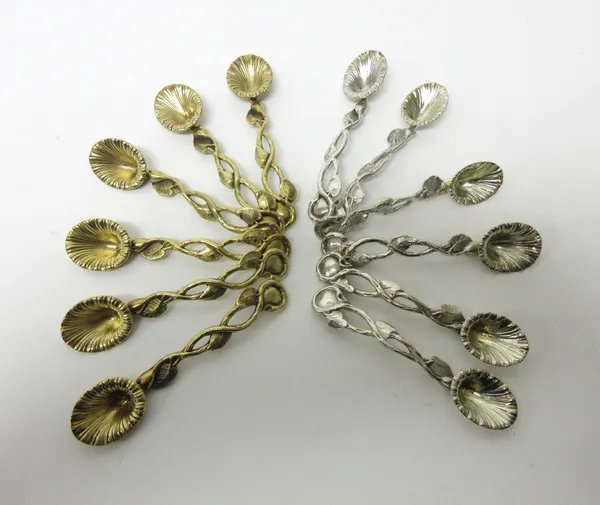 A set of six Victorian silver gilt salt spoons, each of cast and pierced floral and foliate form, Birmingham 1839 and six further silver salt spoons i