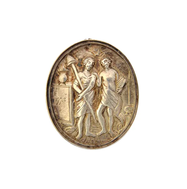 A George III silver oval medallion, the obverse depicting two standing figures and engraved 1773, the reverse fitted with a suspension loop and engrav