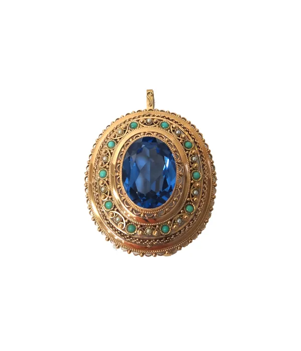 A gold, blue topaz, turquoise and seed pearl set oval pendant brooch, mounted with the oval cut blue topaz at the centre, within a pierced openwork su