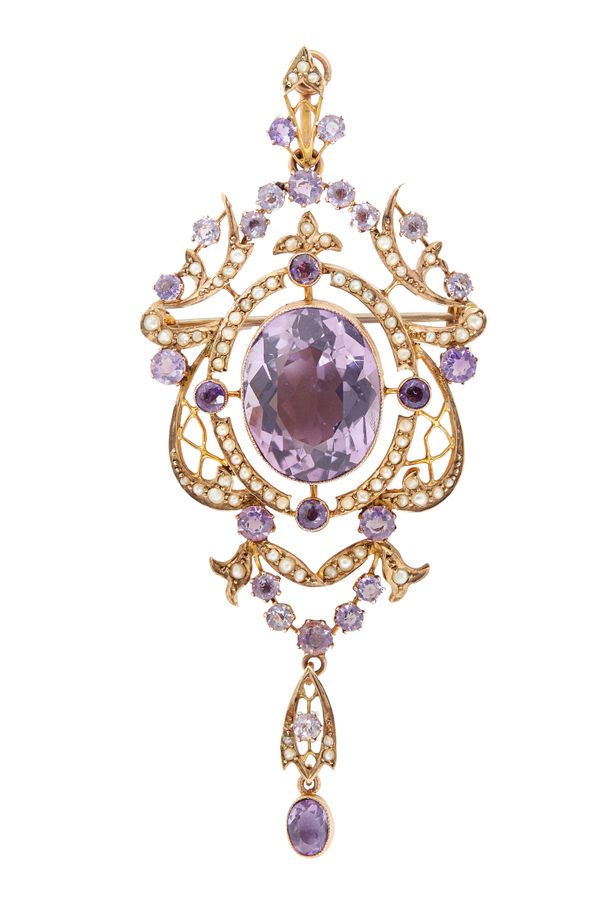 A gold, amethyst and seed pearl set pendant brooch, in an openwork pierced panel shaped design, mounted with the principal oval cut amethyst to the ce
