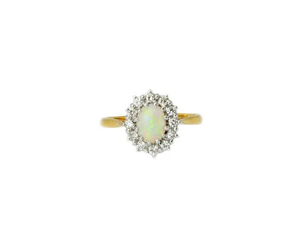 An 18ct gold, opal and diamond oval cluster ring, claw set with the oval opal at the centre, in a surround of circular cut diamonds, detailed 18 CT, r