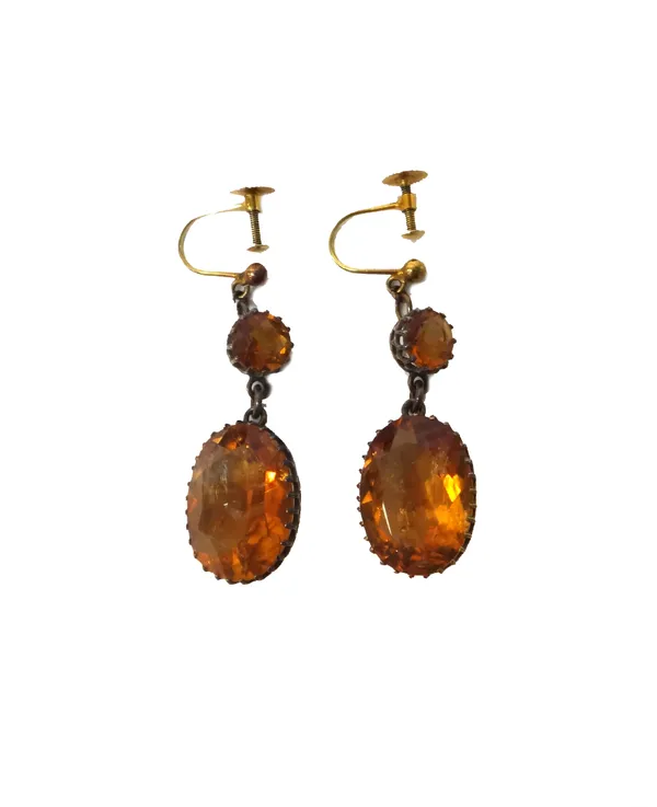 A pair of citrine pendant earrings, each claw set with the oval cut citrine to the drop and with a circular cut citrine mounted above, the tops with s