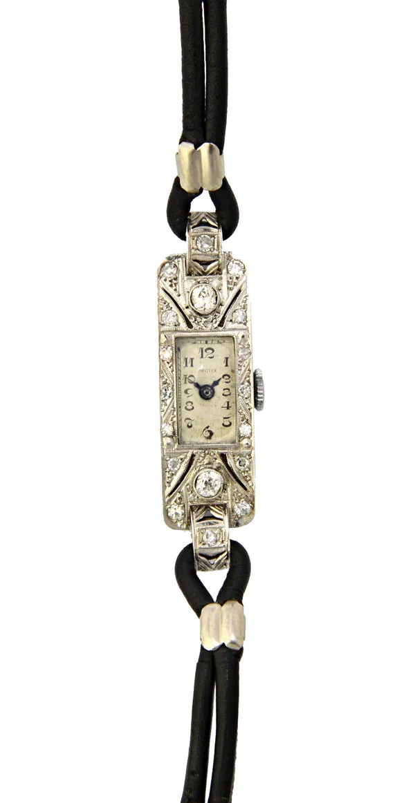 A lady's diamond set rectangular cased dress wristwatch, with a Swiss jewelled lever movement, the rectangular silvered dial with black Arabic numeral