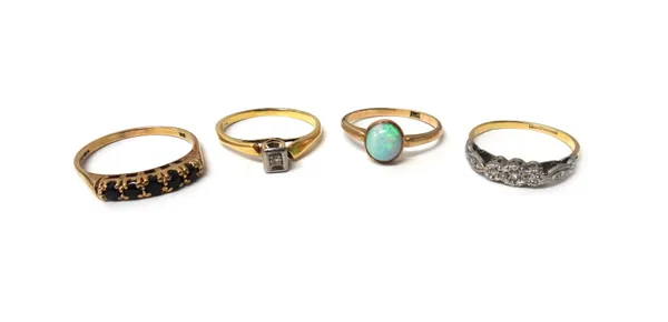 A gold ring, mounted with an oval opal detailed 9 CT, a 9ct gold and sapphire set five stone half hoop ring, a gold and diamond set single stone ring,