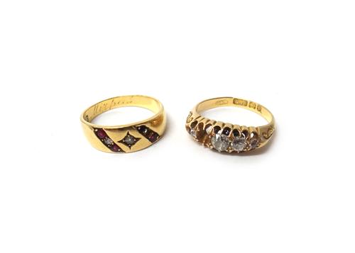 A Victorian 18ct gold ring, mounted with four cushion shaped diamonds (the fifth diamond lacking), Birmingham 1898, ring size P and a Victorian 18ct g