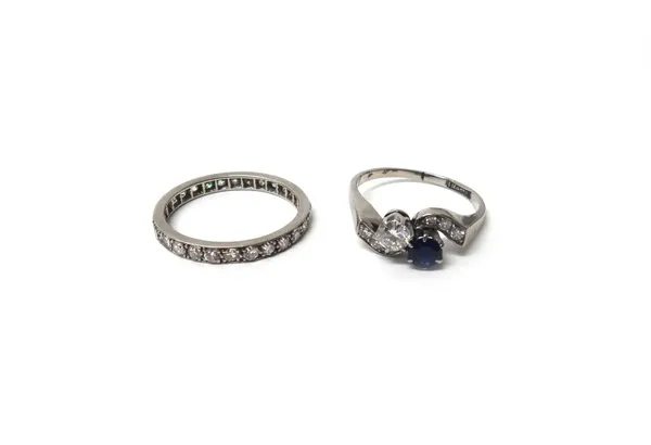A diamond set full eternity ring, mounted with circular cut diamonds, ring size M and a half and a diamond and sapphire ring, claw set with the princi