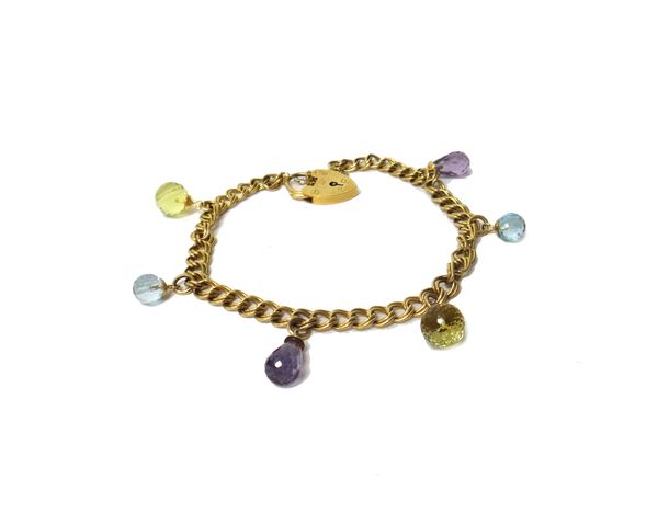 A 9ct gold twin curb link bracelet, fitted with six faceted coloured stone charms, including two amethysts, on a 9ct gold heart shaped padlock clasp,