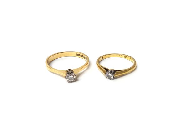 A Swedish gold and diamond set single stone ring, claw set with a circular cut diamond, detailed 18 K, ring size N and a half and an 18ct gold, platin