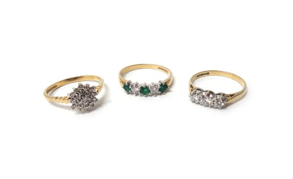 A 9ct gold, emerald and diamond five stone ring, claw set with three circular cut emeralds and with two circular cut diamonds mounted at intervals, a