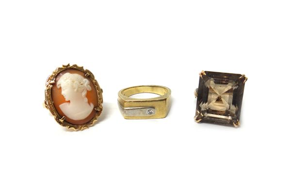 A gold ring, claw set with a rectangular step cut smoky quartz, detailed '14K', a gold ring mounted with an oval shell cameo carved as the portrait of