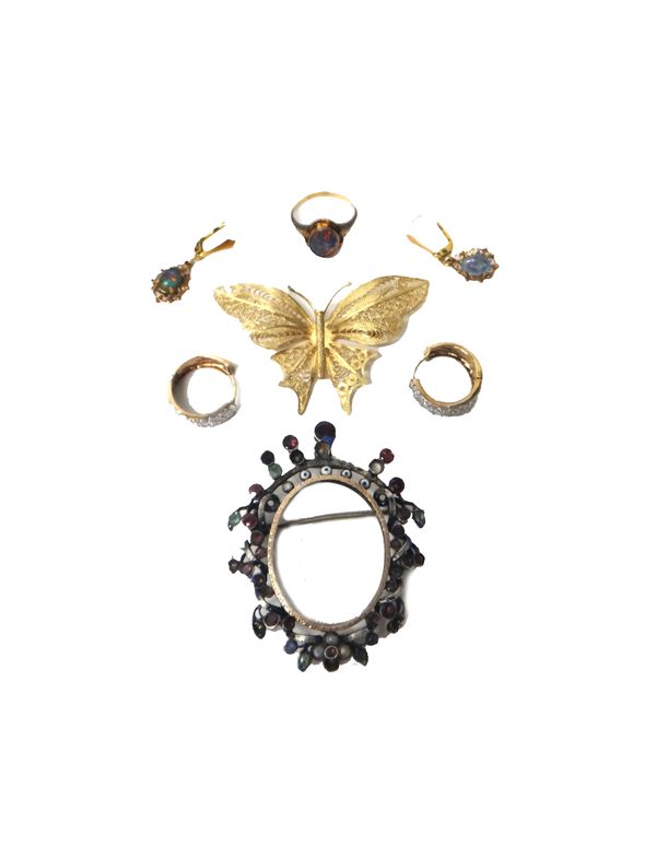 A 9ct gold filigree brooch designed as a butterfly, an enamelled and garnet set shaped oval brooch frame, possibly Austro Hungarian 19th century, a go