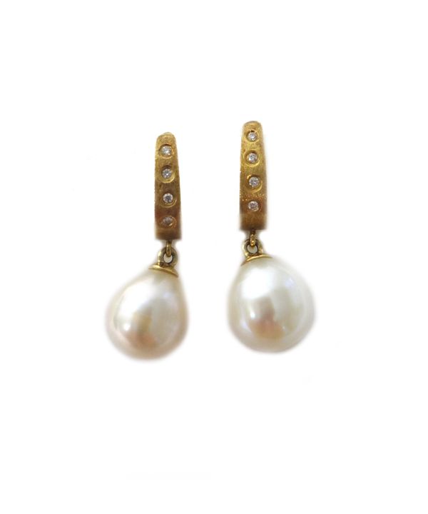 A pair of gold, diamond and cultured pearl earrings, each drop with a single freshwater cultured pearl, each top mounted with a row of four circular c