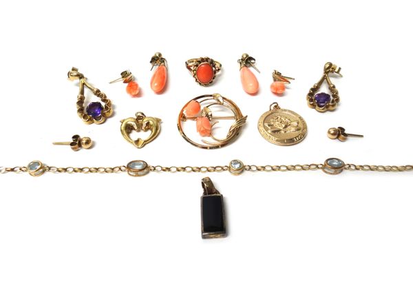 A gold ring mounted with an oval coral, detailed '14ct', two pairs of gold mounted coral earrings, a pair of 9ct gold and amethyst set pendant earring