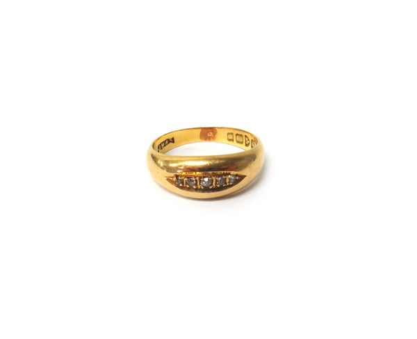 An 18ct gold and diamond ring, mounted with a row of five small cushion shaped diamonds, within a boat shaped setting, Chester 1919, ring size K and a