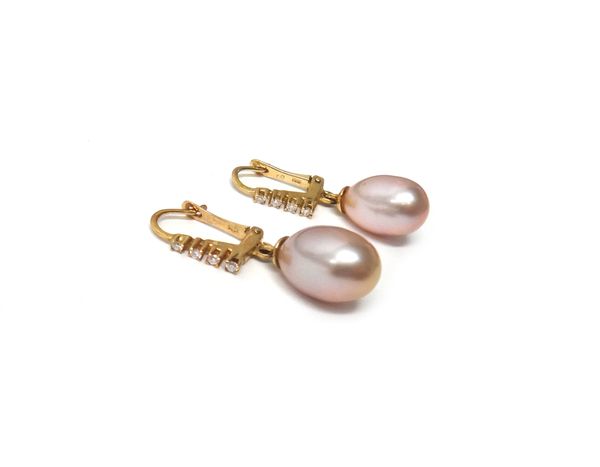 A pair of gold, diamond and pink cultured pearl earrings, each drop with a single pink freshwater cultured pearl, each top claw set with a row of four