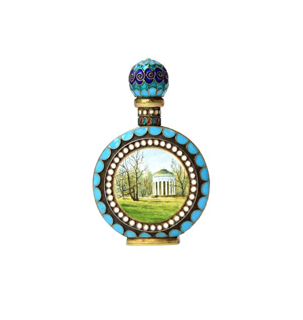 A Russian style gilt and enamelled scent bottle, of circular form, enamelled with buildings in landscape scenes to either side, within a white enamell