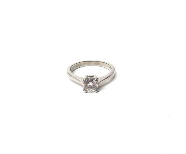 An 18ct  white gold and diamond set single stone ring, claw set with a circular cut diamond, ring size L, with a case.