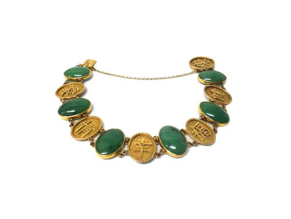 An Oriental gold and cabochon green gem set bracelet, the oval green cabochon gems spaced with Oriental characters at intervals, on a snap clasp detai