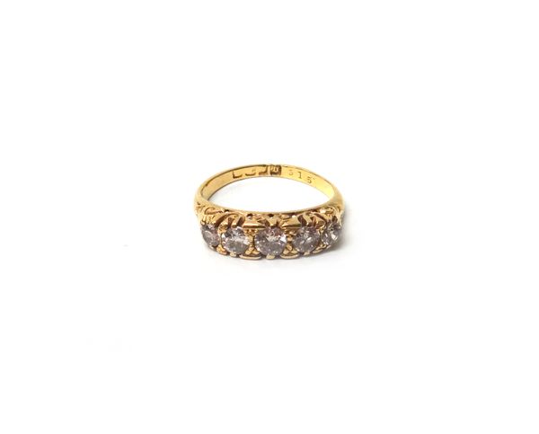 A gold and diamond set five stone ring, mounted with a row of cushion shaped diamonds graduating in size to the centre stone,  the mount decorated wit