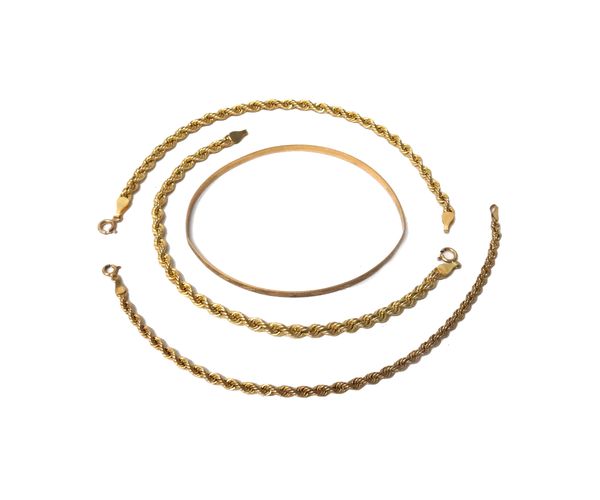 Three 9ct gold ropetwist link bracelets with sprung hook shaped clasps and a 9ct gold bangle with engraved decoration, combined weight 11 gms, (4).