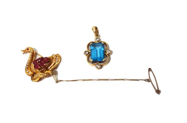 A gold, ruby and diamond brooch, designed as a bird, mounted with four oval cut rubies and otherwise set with circular cut diamonds, fitted with a saf