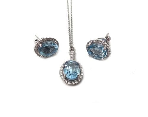 A pair of aquamarine and diamond oval cluster earstuds, each claw set with an oval cut aquamarine, within a surround of circular cut diamonds, the bac