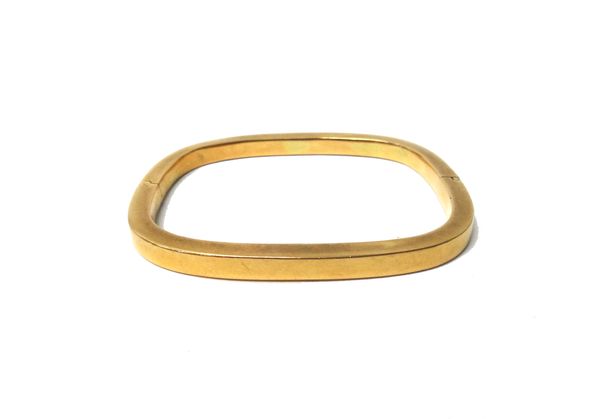 A gold hollow hinged bangle, of curved square section form, on a snap clasp, detailed 750, gross weight 20.8 gms.