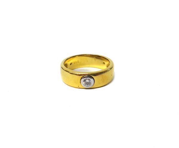 A gold and diamond set single stone band ring, collet set, with a circular cut diamond, ring size O, gross weight 8 gms, with a case.