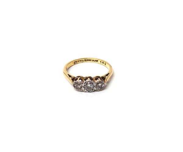 A gold and platinum, diamond set three stone ring, mounted with a row of circular cut diamonds, detailed '18ct PLAT', ring size K and a half, with a c