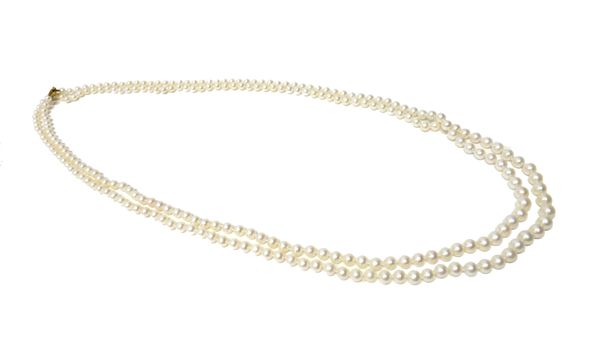 A two row necklace of graduated cultured pearls, on a 9ct gold sliding clasp, detailed 375, length of shortest row 88cm.   56