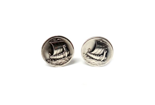 A pair of Georg Jensen silver cufflinks, the circular fronts with Viking ship motifs and with folding oval fittings to the backs, detailed Georg Jense