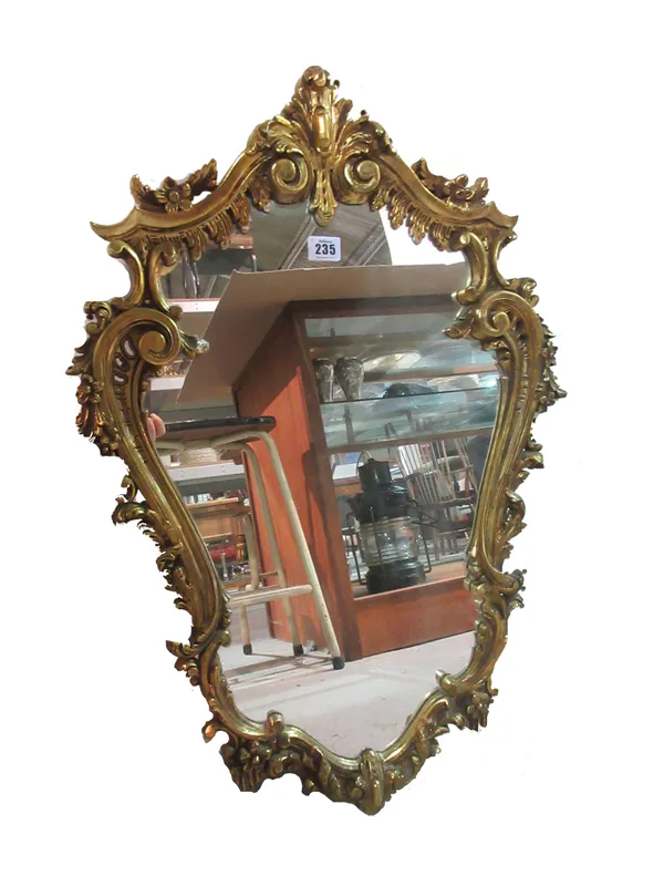 A 20th century gilt framed mirror, with scrolling acanthus border, 73cm high x 50cm wide.   A3
